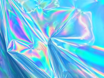 holographic iridescent surface wrinkled foil pastel. real hologram background of wrinkled abstract foil 80s texture with multiple colors. 90s blue pastel holographic gradient mesh template surface.