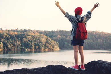 asian girl backpack in nature , relax time on holiday concept travel,selective and soft focus,tone of hipster style