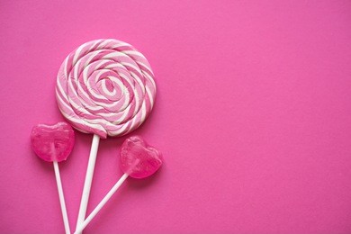 pink valentines day heart shape lollipop candy on empty pink