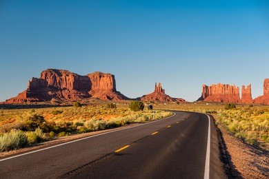 empty scenic highway in monument valley, arizona, usa