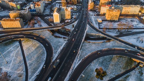 aerial view on riga elevated road junction and interchange overpass at winter sunset time