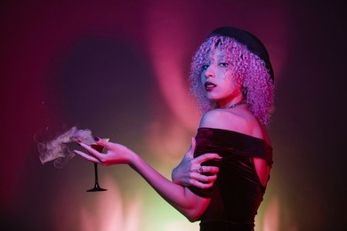sexy afro woman drinking spirit drinks at a mystery club