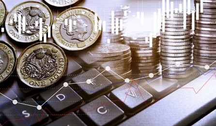 double exposure of uk stock graphic with keyboard new pound coin background on financial market trade chart, finance and banking concept. mixed media.