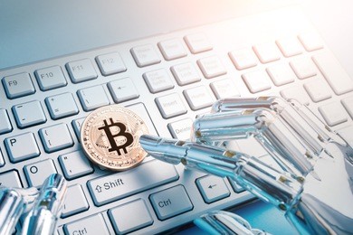 robot hand with bitcoin on the table