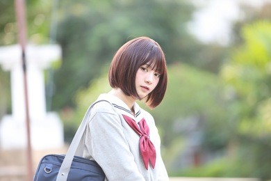 portrait of japanese school girl with countryside park