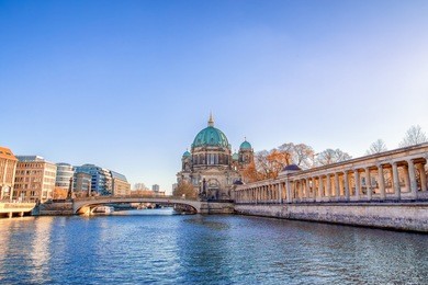 berlin cathedral (berliner dom) and museum island (museumsinsel) reflected in spree river, berlin, germany, europe.