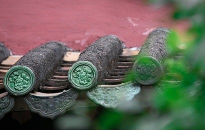 peaceful traditional chinese house with decorative tiles on the eaves 