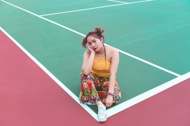 hipster asian girl pose for take a photo,fashion portrait pretty fat woman at tennis court,lifestyle of modern teenage thai girl
