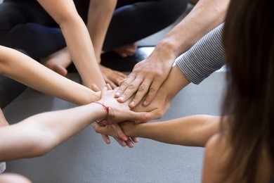 close up of high five hand gesture, symbol of common celebration or greeting, people planning to reach their goal, slap each other to start working together. success and teamwork concept