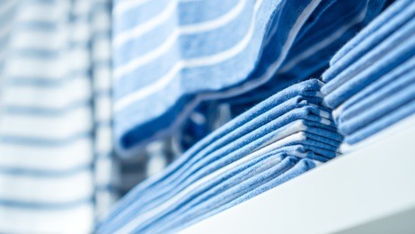 close up of folded clothes on the closet.