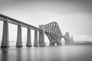 forth road bridge in black and white photo.