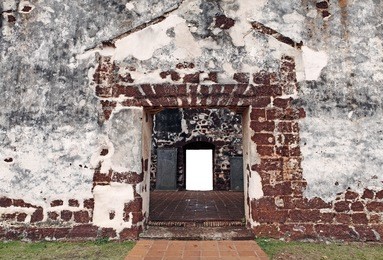 ancient stone entrance doorway into the historical tourist attraction, st. paul's church in melaka city, malaysia.