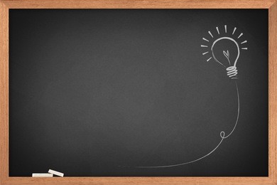 drawing of a bulb idea on blackboard