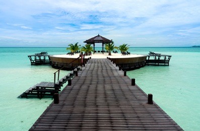 a man-made walkway kapalai island with exotic tropical resort