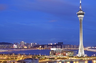 urban landscape of macau with famous traveling tower under sky near river in macao, asia.