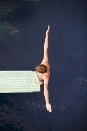 boy standing on springboard
