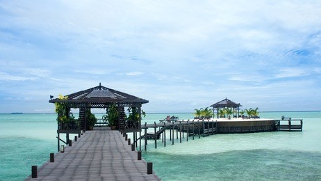 a man-made walkway kapalai island with exotic tropical resort