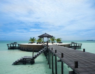 a man-made walkway kapalai island with exotic tropical resort
