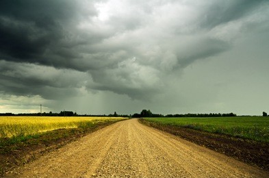 stormy sky over the ground road.