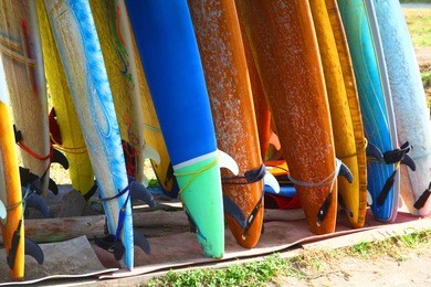 surf boards standing on kuta bali beach