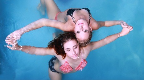 beautiful girls dancing in swimming pool