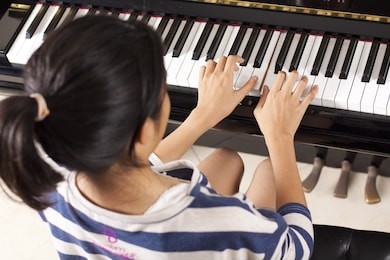 practice piano, asian teenage girl practicing piano.