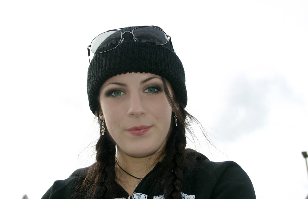 girl in beanie looks perplexed