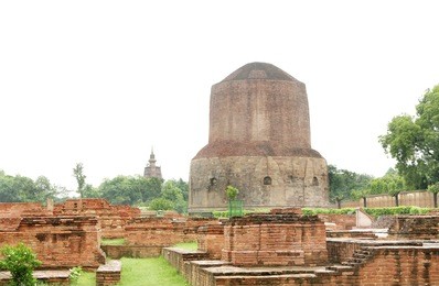 beautiful view of miniature votive stupas and the dhamekh stupa
