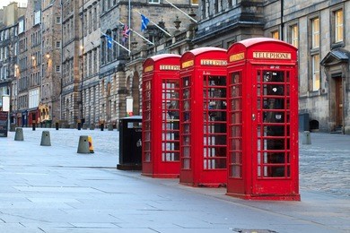 red telephone booths along the famous royal mile in edinburgh, capital of scotland