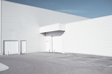 white industrial architecture - outdoor view of a white faded store architecture