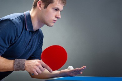 young sportsman playing table tennis