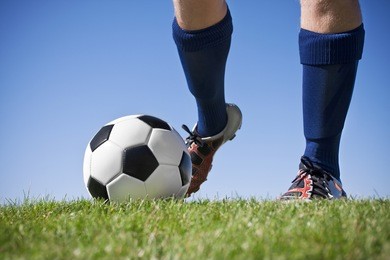 kicking the soccer ball (close, low angle view)
