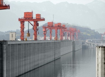 the three gorges dam at yangtze river in china in foggy ambiance