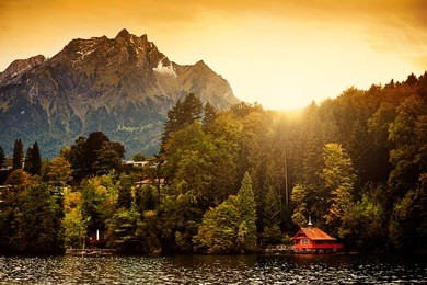 switzerland alps sunrise on lucerne lake with mount pilatus in the background.