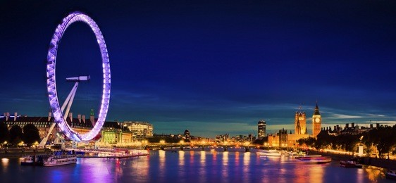 london at twilight. london eye, county hall, westminster bridge, big ben and houses of parliament.