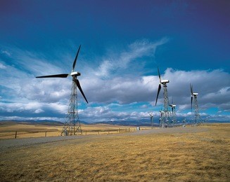 windmill turbines by rocky mountains in cowley, alberta, canada