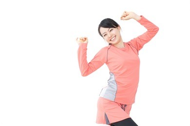 beautiful young woman doing exercise isolated over white background