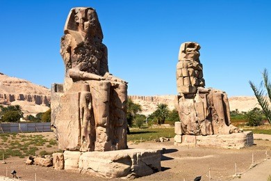 giant statues near the kings valley, luxor, egypt