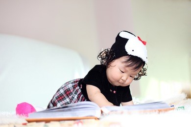 asian baby with book