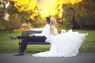 bride and groom in a park