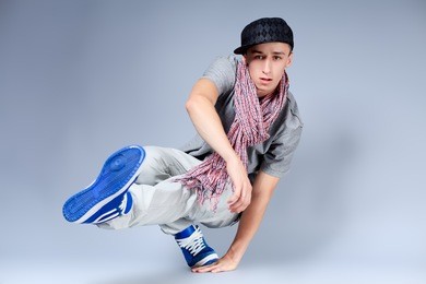 young man dancing hip-hop at studio.
