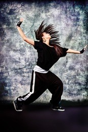 modern teenage girl dancing hip-hop at studio.