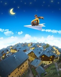pilot riding the paper plane above sleepy town in the moonlight