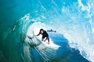 surfer on blue ocean wave