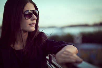 fashion model wearing sunglasses outdoors closeup portrait