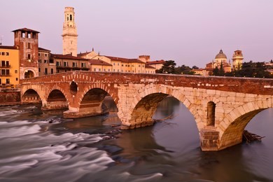 romantic bridge in the morning light in verona, italy