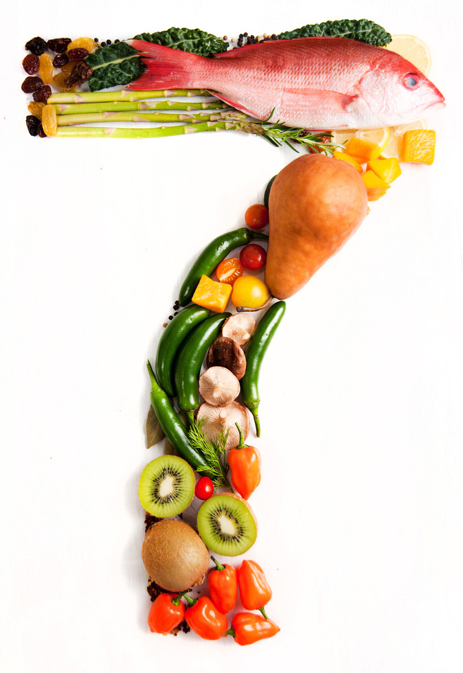 healthy vegetables, meats, fruit and fish shaped in number seven 7