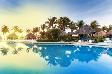 tropical swimming pool at sunrise in mexico