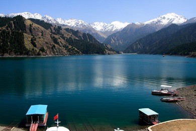 tianchi lake(heaven's lake) a beautiful lake in tianshan mountains, xinjiang, china.tianchi lake 's elevation is 1980 meters, 3.5 kilometers long, the deepest place of the lake is 103 meters.