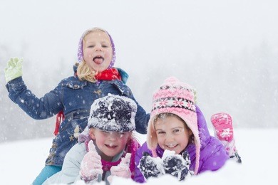 happy children playing on snow